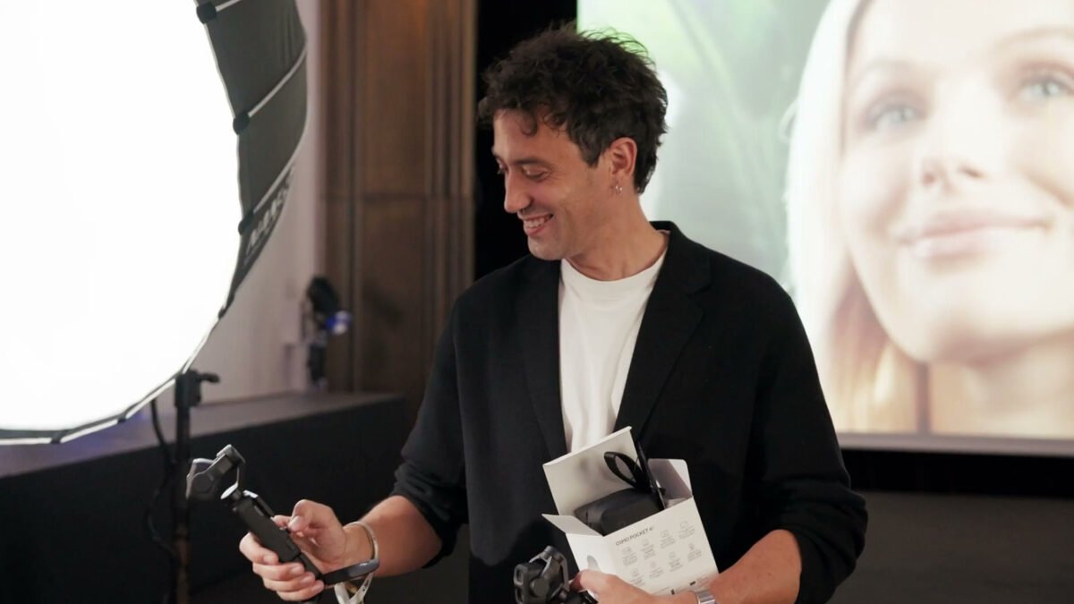 Official DJI Cannes footage showing a creator holding the real Osmo Pocket 4P and its product box at the launch preview event.